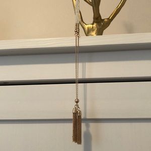 White glassbead/gold colored necklace with tassels